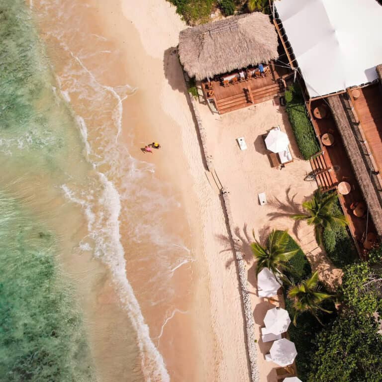 Johnny’s Beach Bar — Where His Spirit Meets the Sea There are places filled with echoes—echoes of laughter, courage, and dreams. At Long Bay Beach Resort, among crashing waves and golden sunsets, lies Johnny’s Beach Bar, a place deeply stitched with memories of Johnny Strange: adventurer, humanitarian, son, and friend.